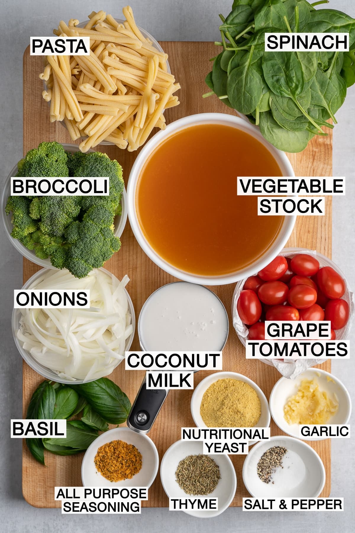 Ingredients for pasta on wooden cutting board