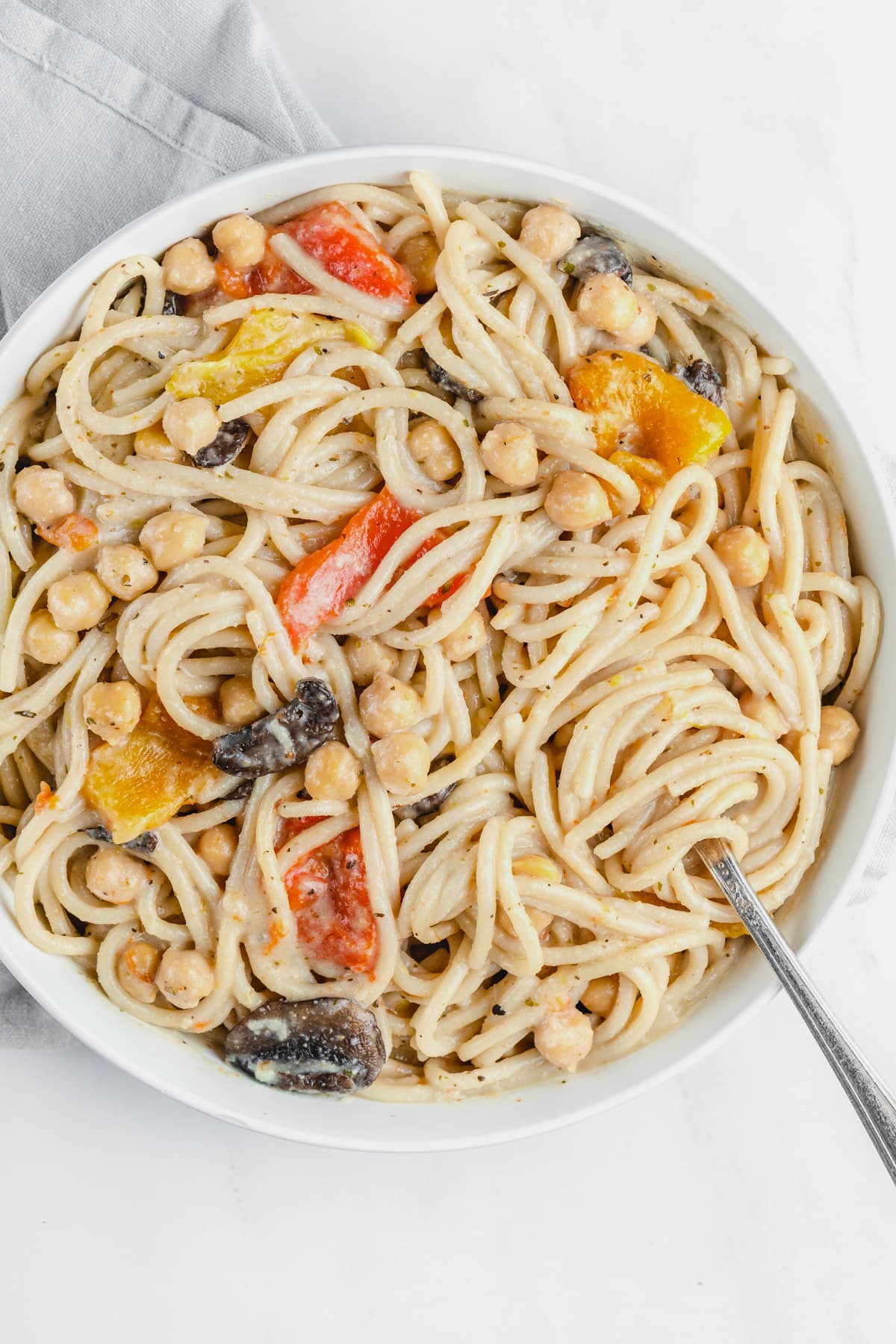 Pasta with peppers and chickpeas in a bowl.
