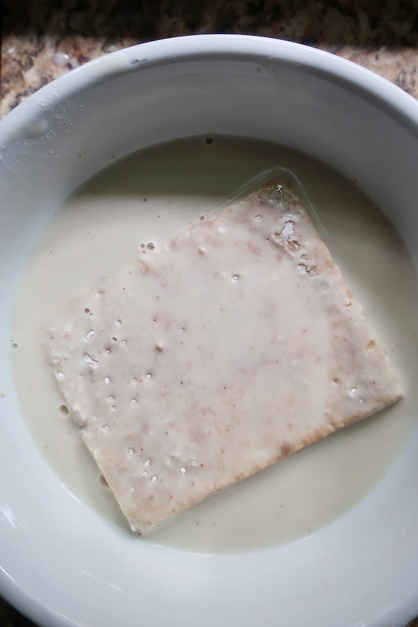Flour coated seasoned tofu dipped in soy milk
