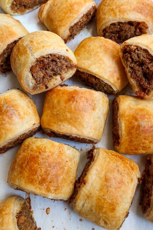 Close up of the baked vegan sausage rolls on a baking sheet