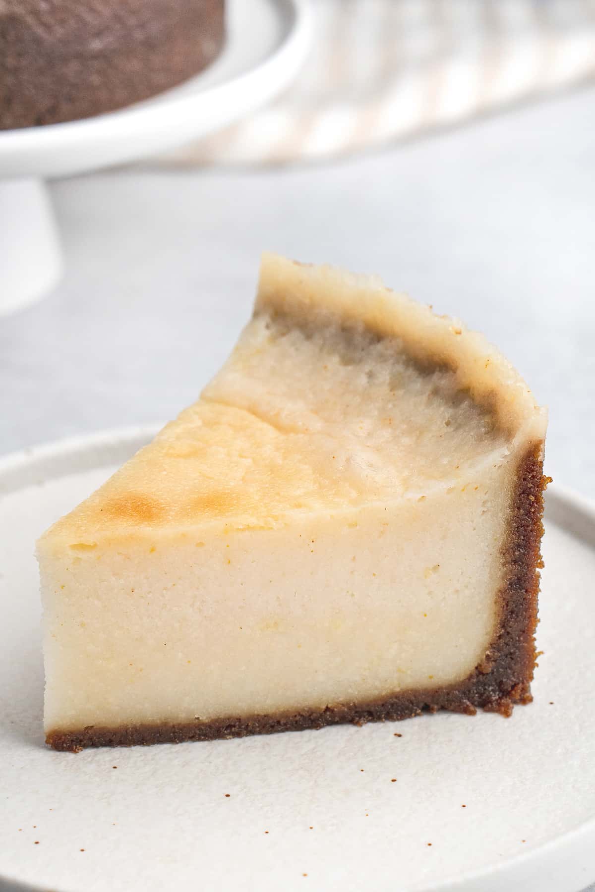 Slice of cheesecake on white plate