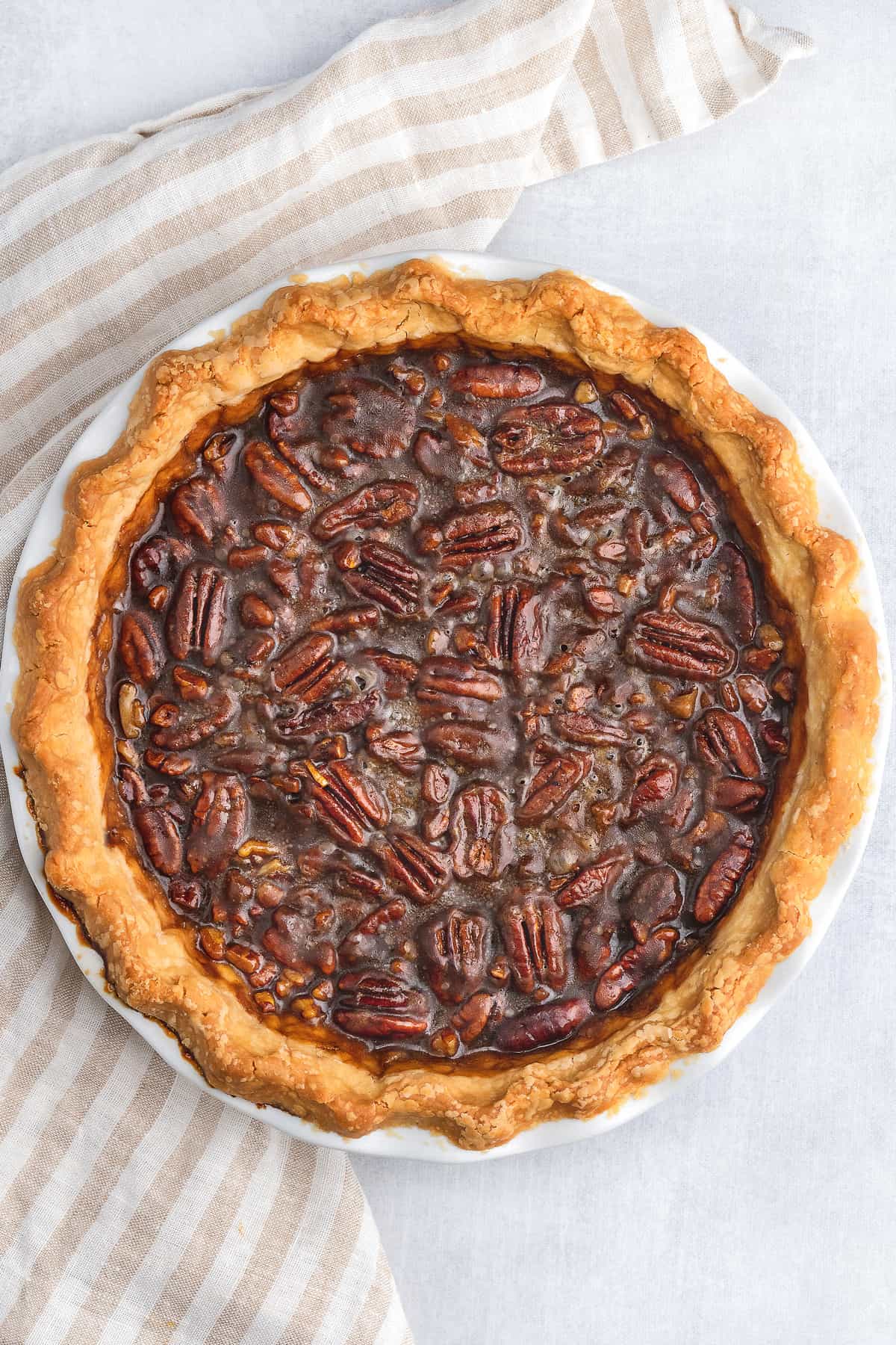 Pecan pie next to striped towel